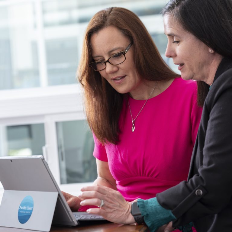 A woman reviewing wealth accumulation with Seattle Financial Planner Taeya Lauer