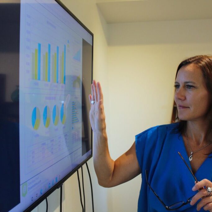 Taeya Lauer of Pacific Coast Financial Services, presenting financial data